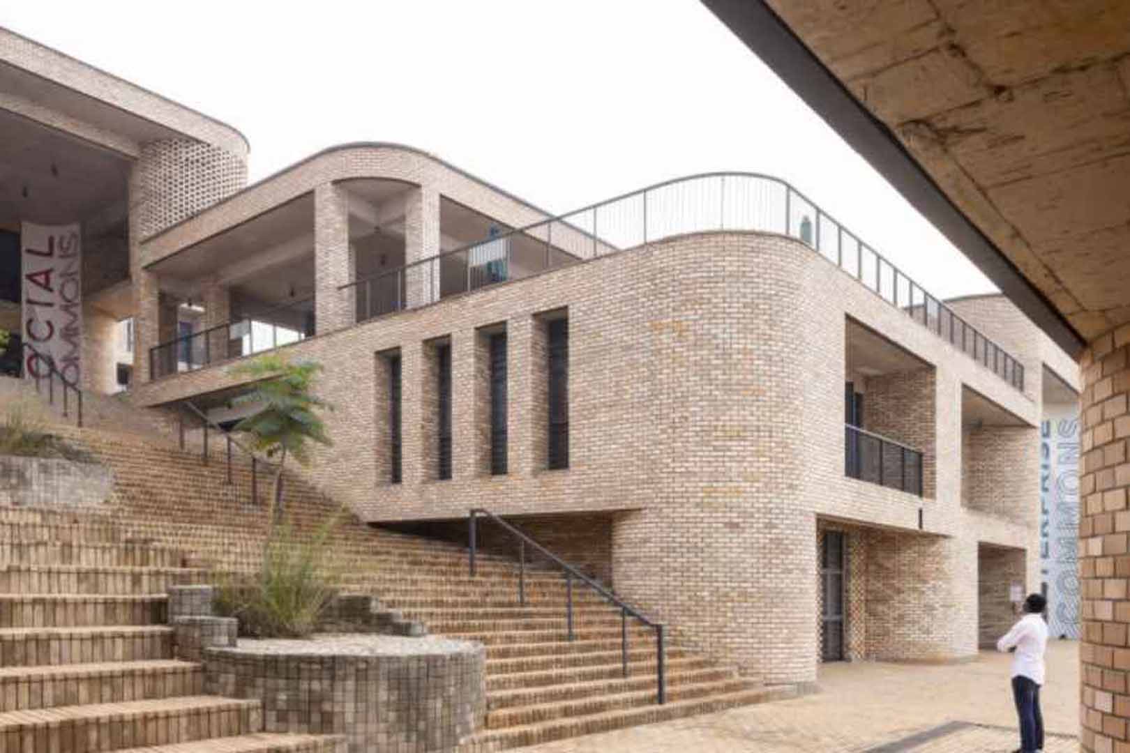 Person standing in front of stairs outside of the African Leadership University