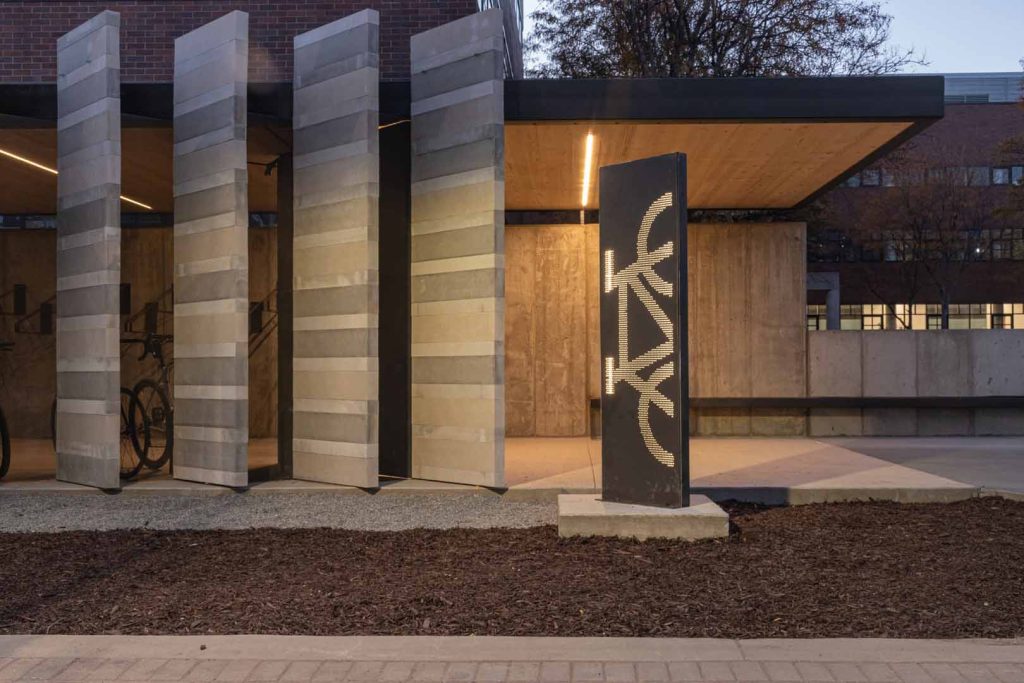 Thin and tall pillars outside of Auraria Bike Pavilions