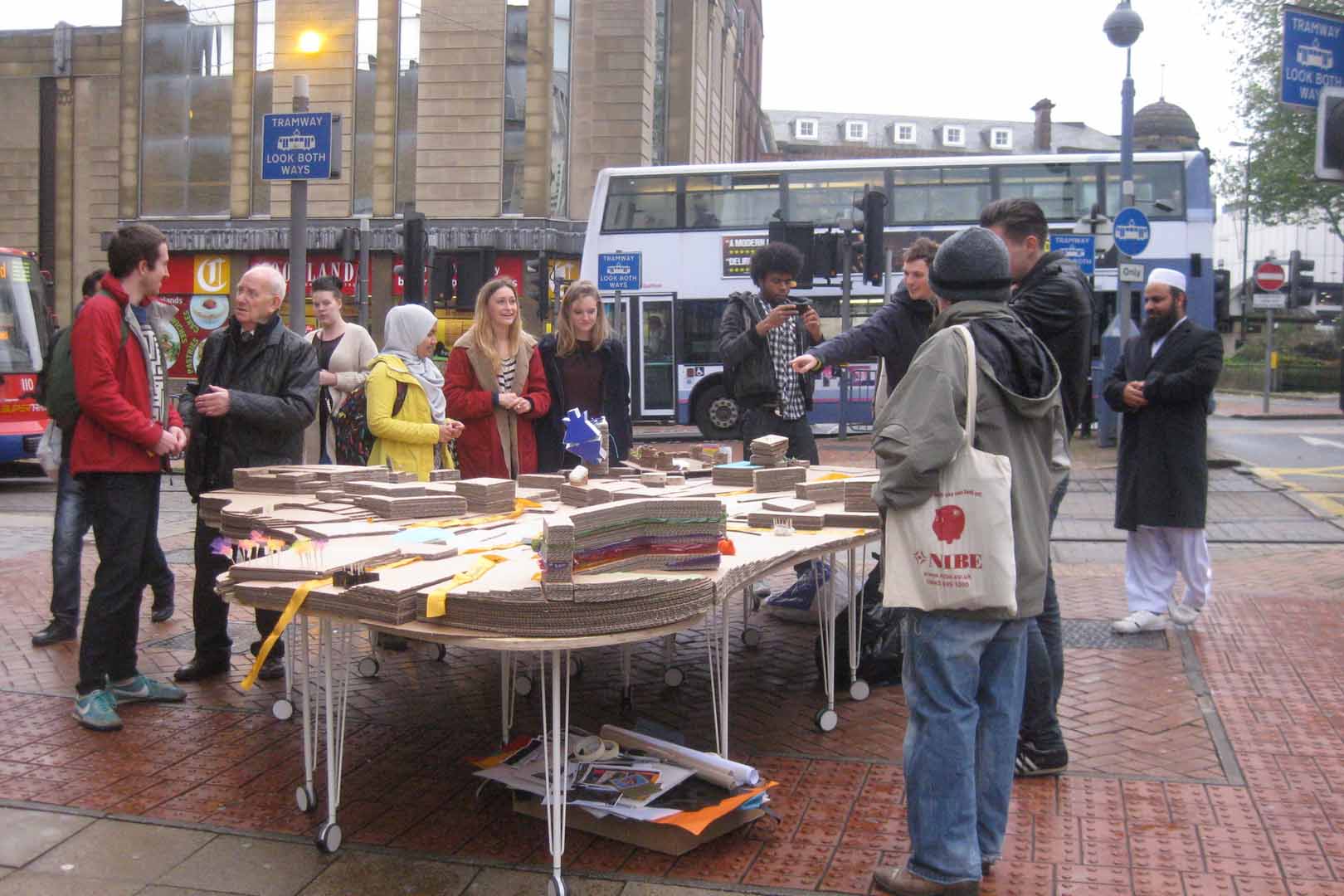 People gathered around a table outside