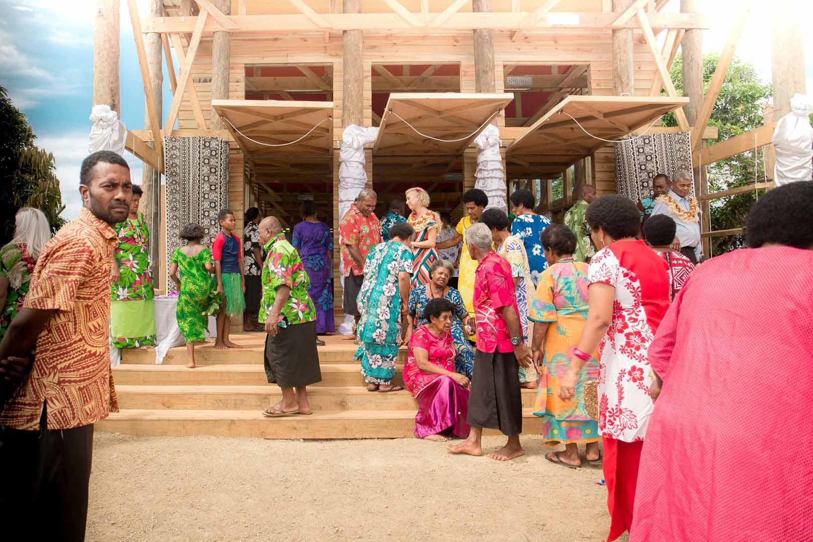 Group of people walking in and out of a building