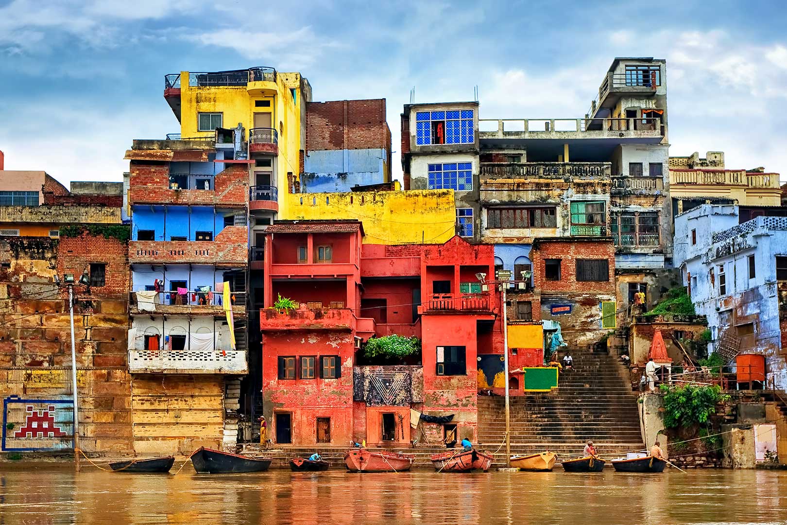 Exterior view of bright multicolored buildings above the water